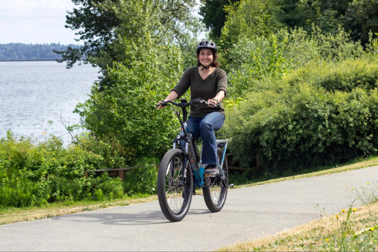 Woman Riding E-Bike on Sidewalk